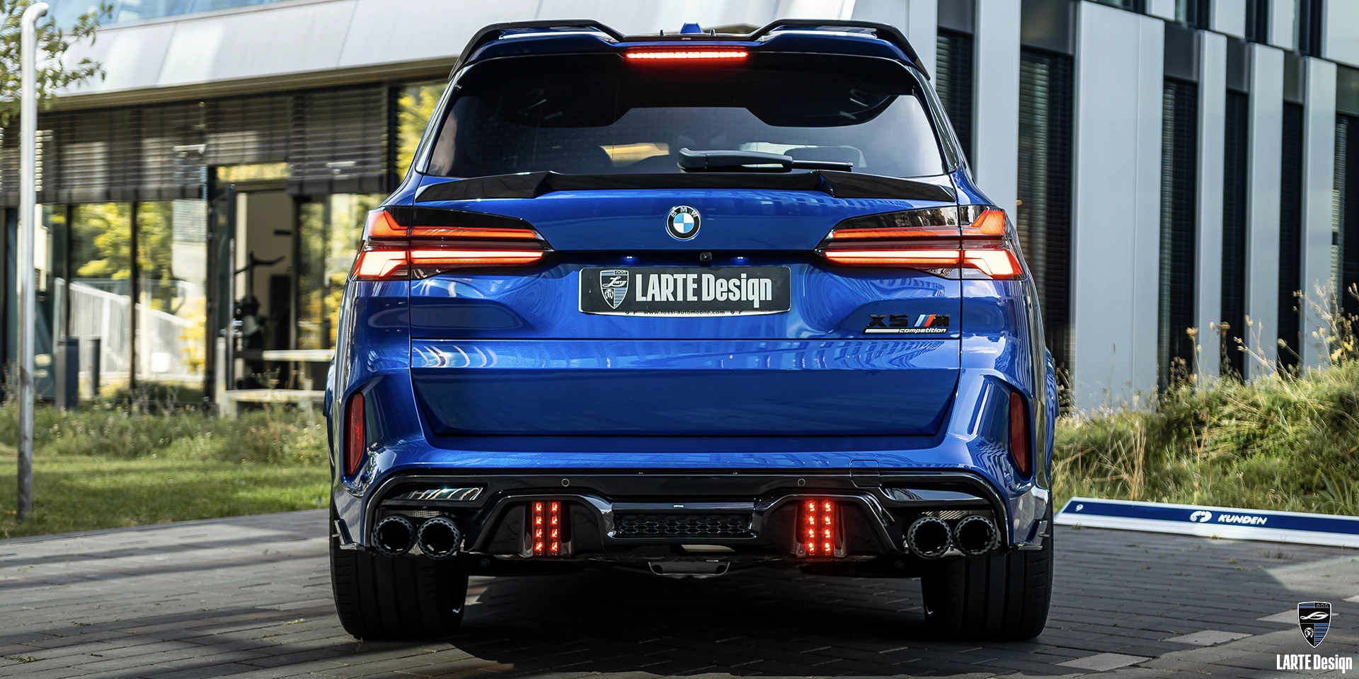 Rear view of BMW X5M Facelift SUV with Larte Design rear diffuser and custom exhaust tips.