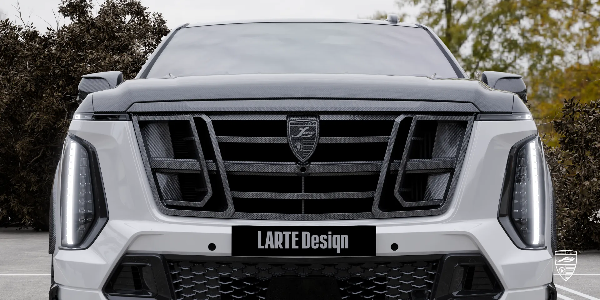 Front view of the Escalade‑V 125th Anniversary: iconic grille, lighting, and carbon highlights