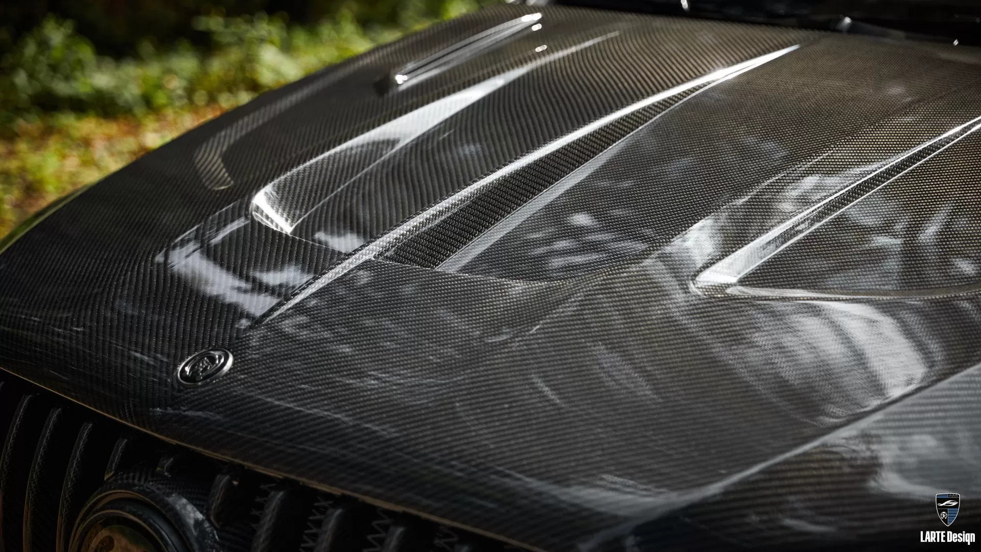 Mercedes hood made from carbon fiber, demonstrating a lightweight and durable body kit material.