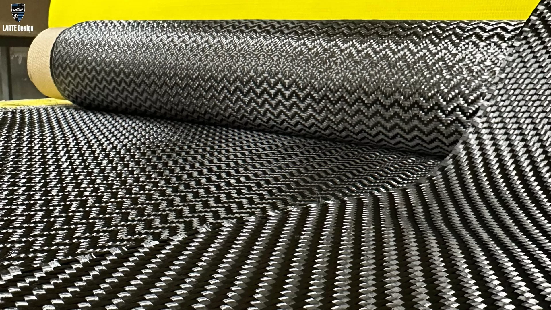 Carbon fiber material used in body kits, known for its lightweight and strong properties.