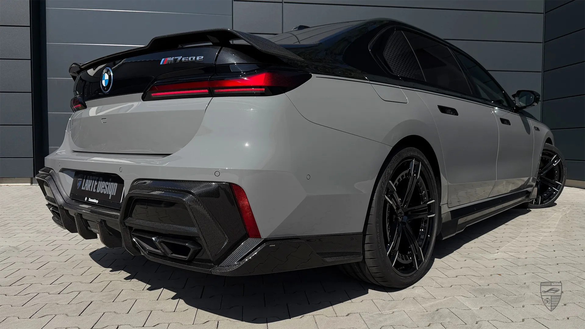 custom BMW 7 Series in grey with rear exterior styling and a refined modified look