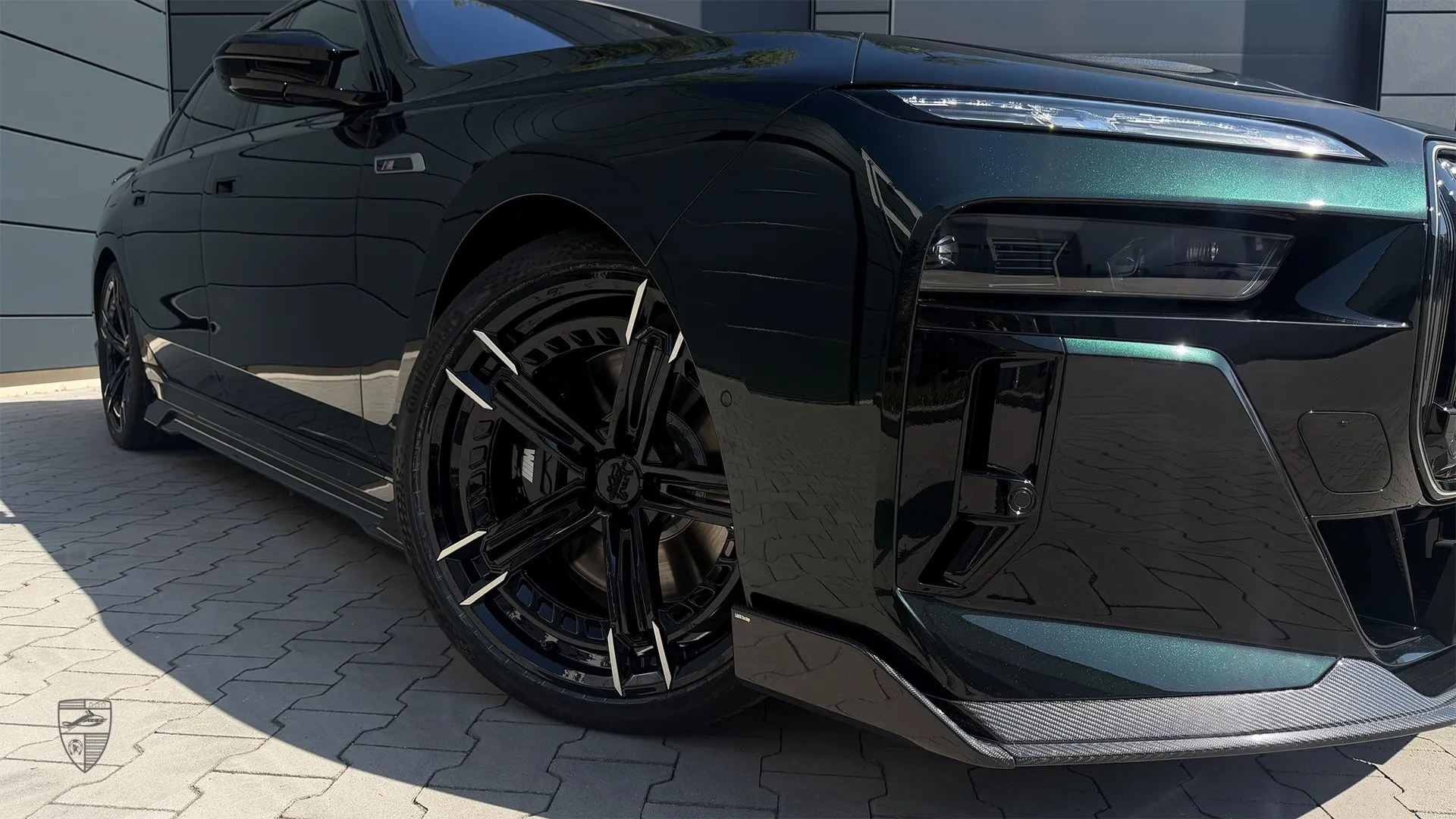 BMW 7 Series modified with distinctive wheel design and custom exterior details