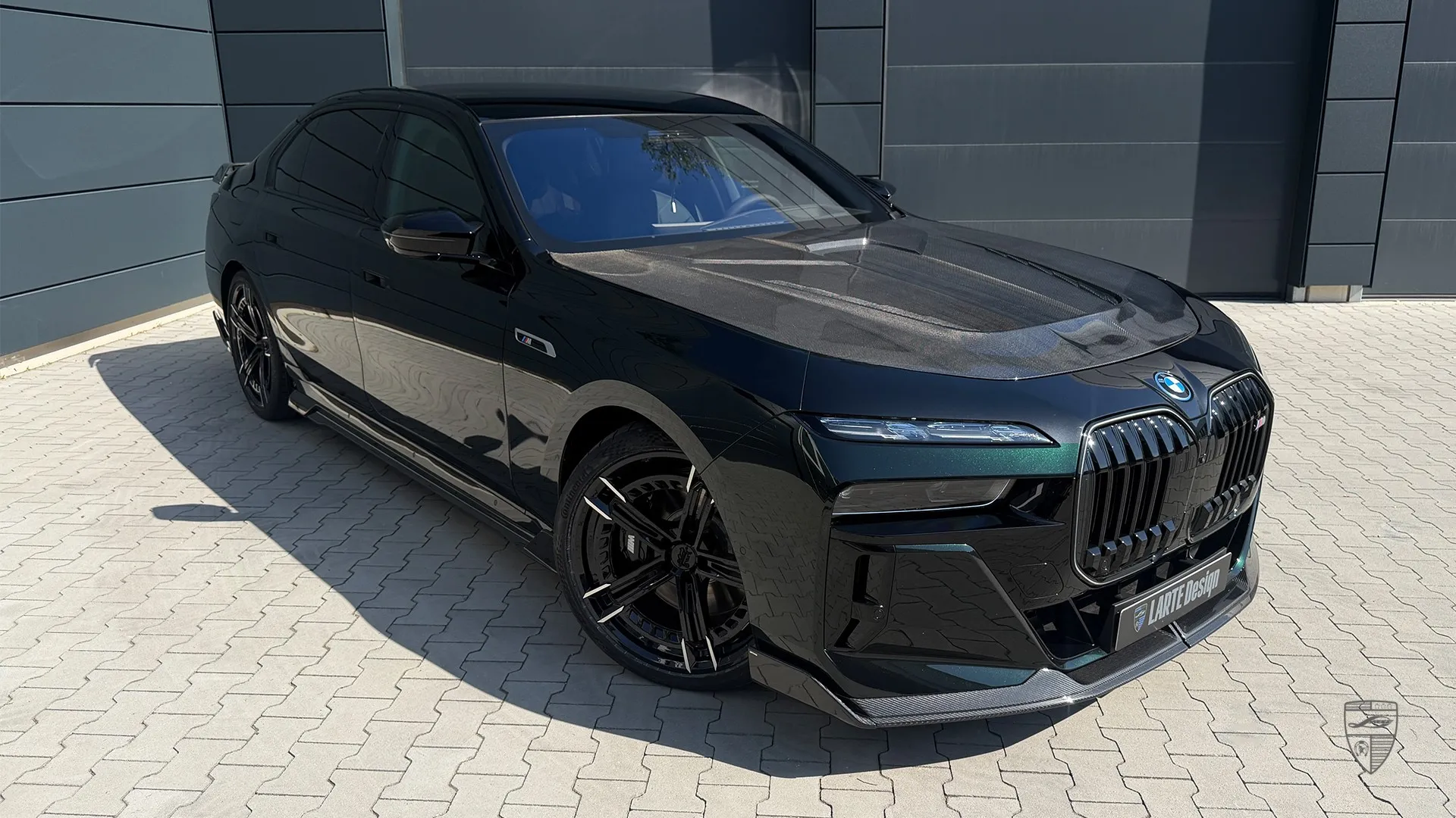 BMW i7 tuning in black shown in front three-quarter view with custom exterior styling