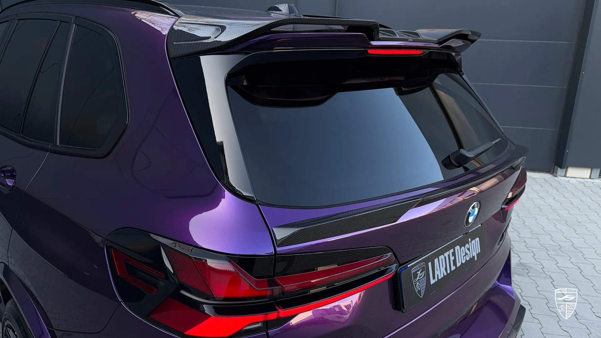 BMW X5M F95 LCI side view in purple with clean exterior styling