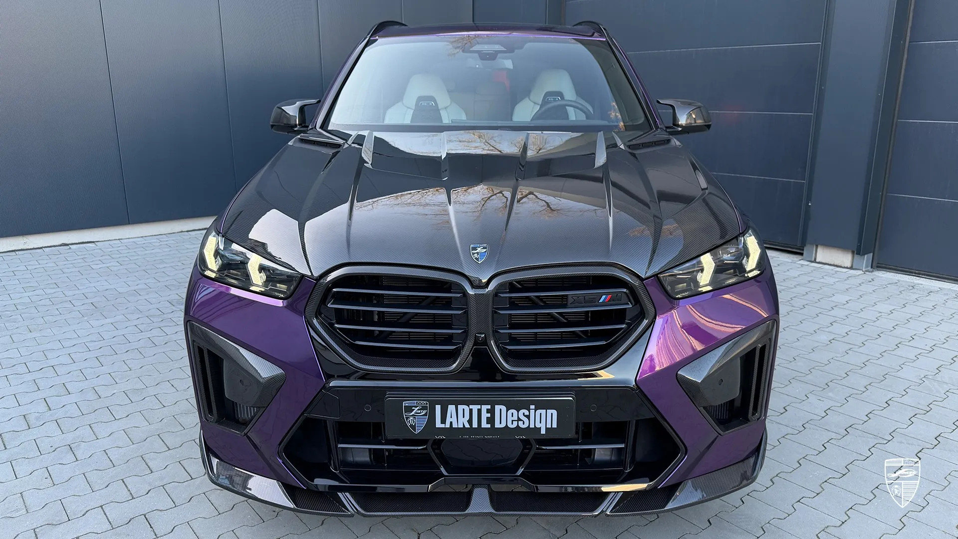 X5M Facelift front view in purple with aggressive grille and updated look