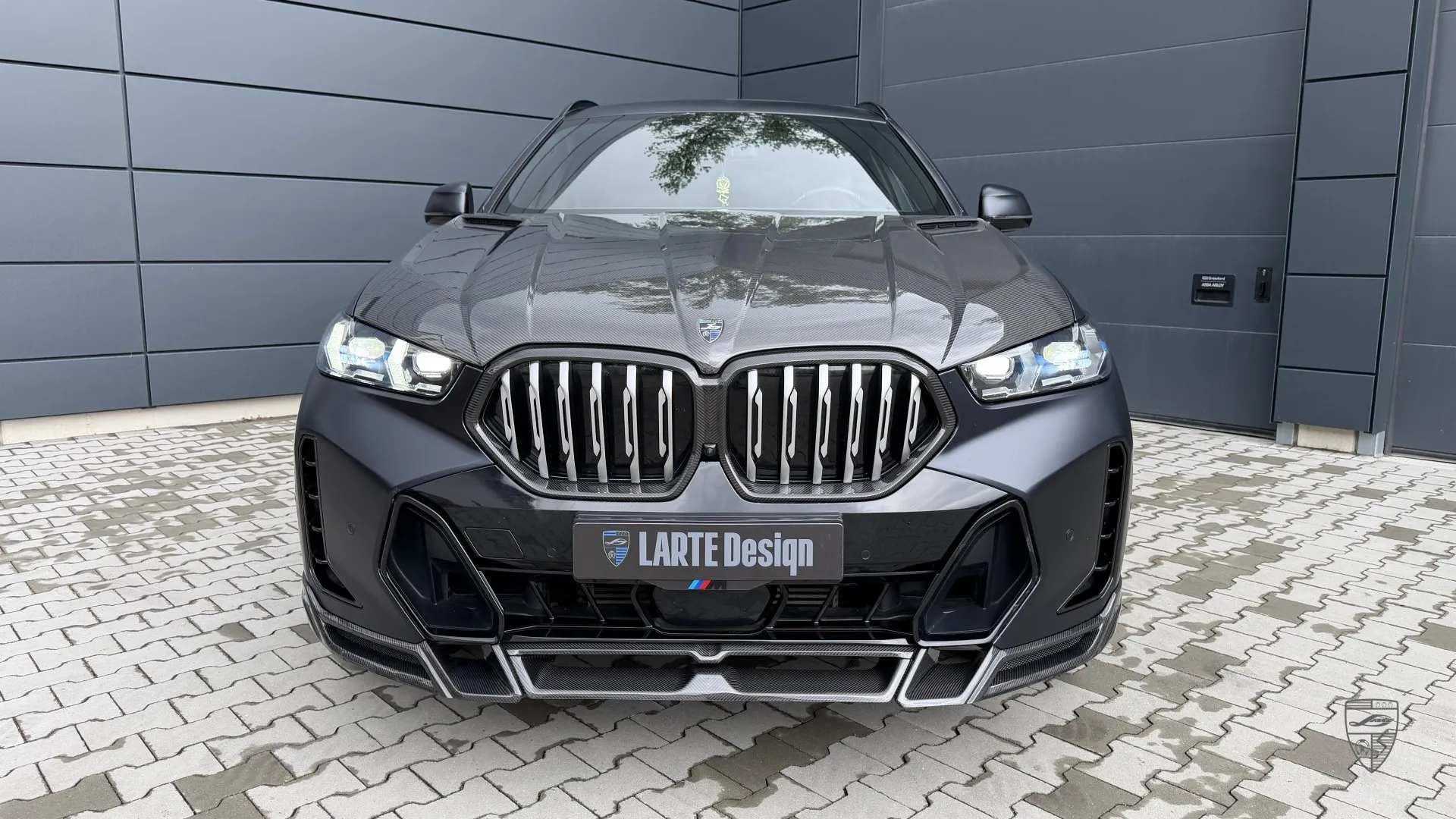 2026 BMW X6 front view with aggressive styling and modified exterior design