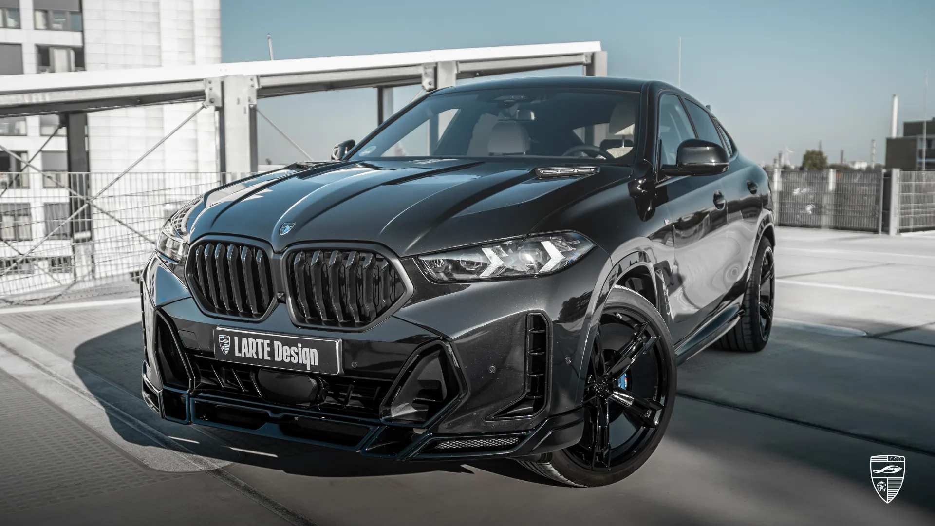 2026 BMW X6 G06 LCI — Obsidian Black SUV with dynamic road stance and aggressive front look