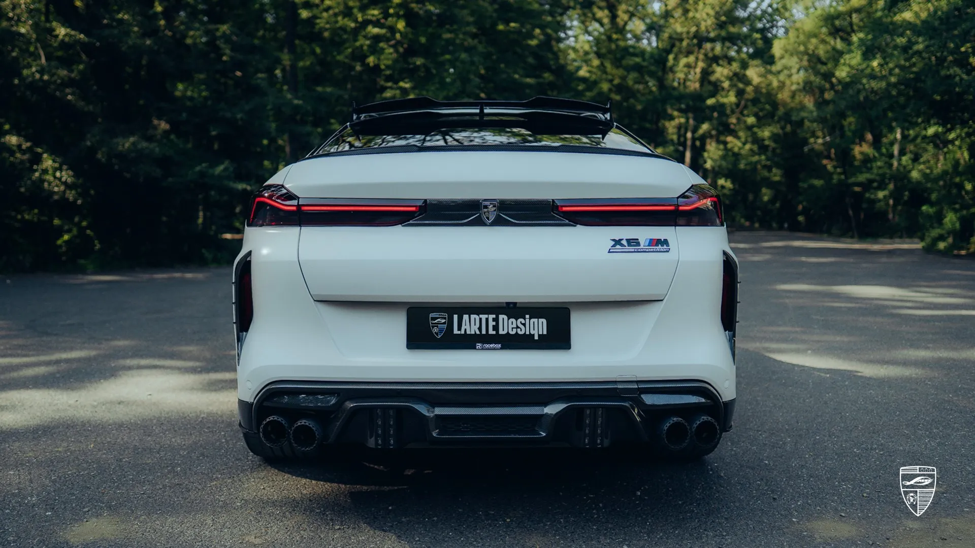 BMW X6M LCI in white shown in rear view with custom exterior upgrades