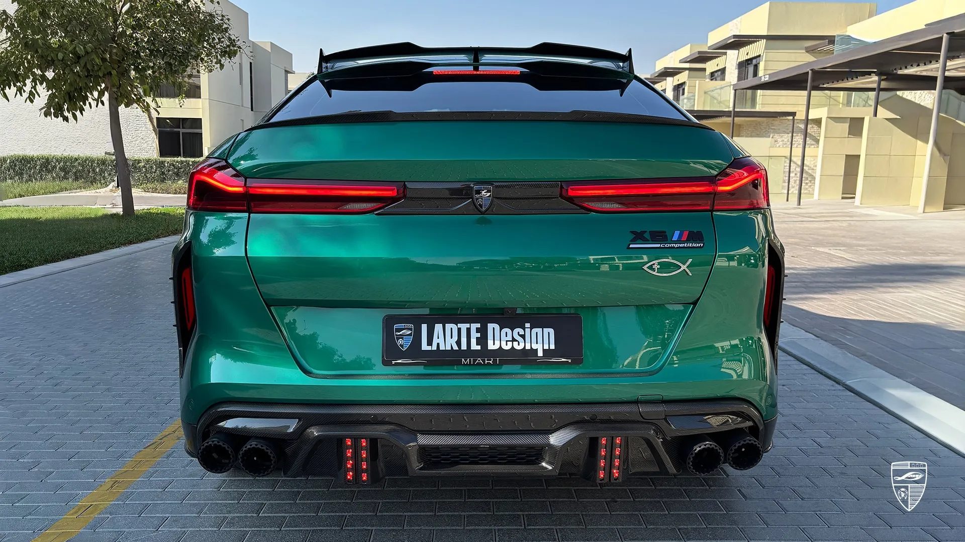 Luxury SUV upgrade — BMW X6M F96 in Isle of Man Green with carbon rear diffuser