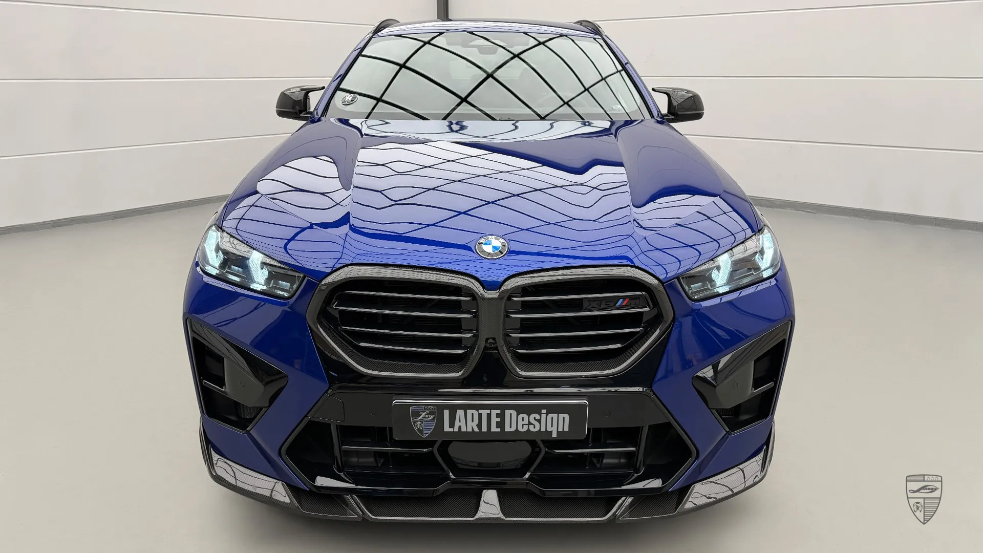 Sporty looking BMW X6M Competition F96 LCI in Marina Blue Bay, featuring lightweight tuning parts