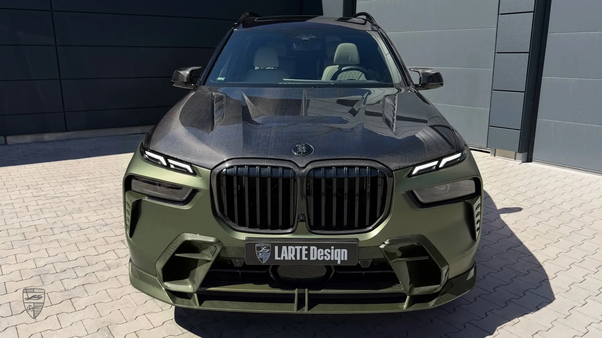 BMW X7 carbon exterior with front view and a modern customized SUV design