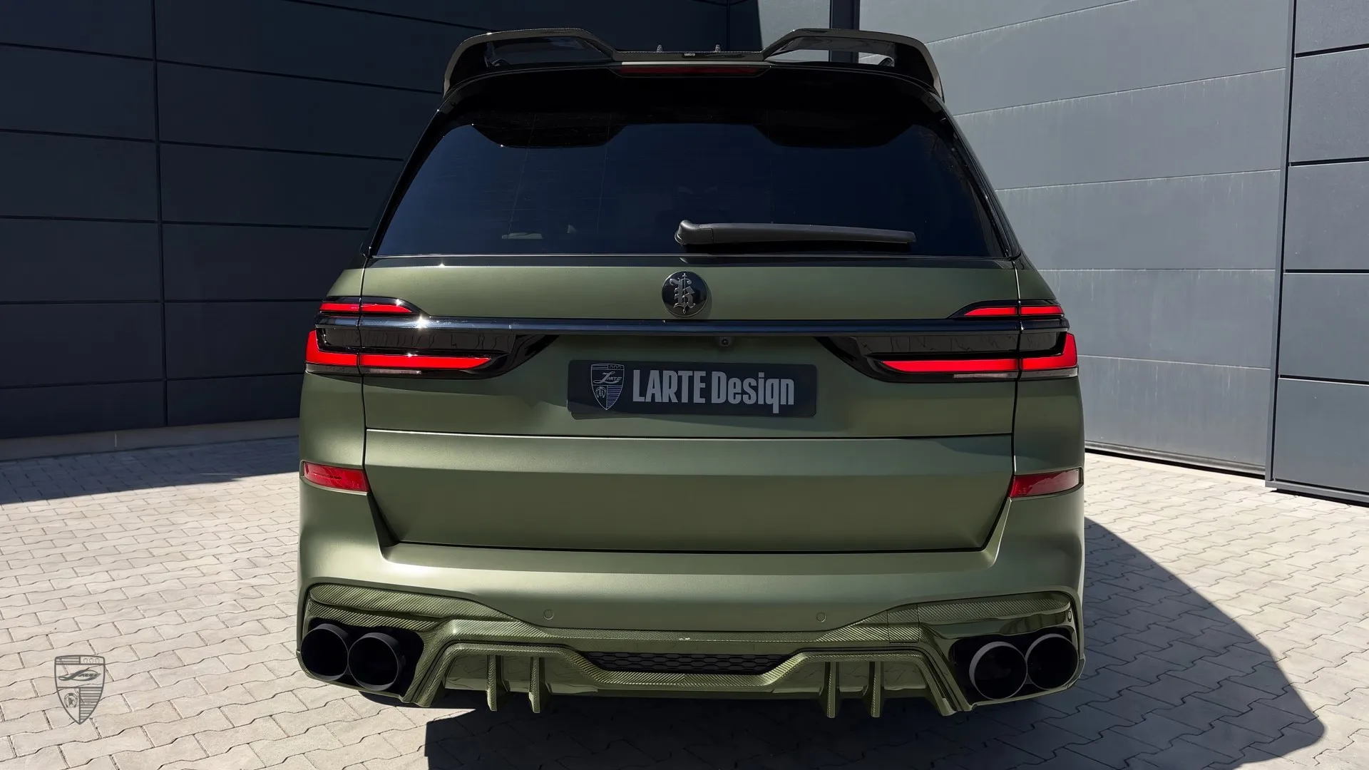 BMW X7 luxury SUV in matte green with custom rear styling and refined exterior details