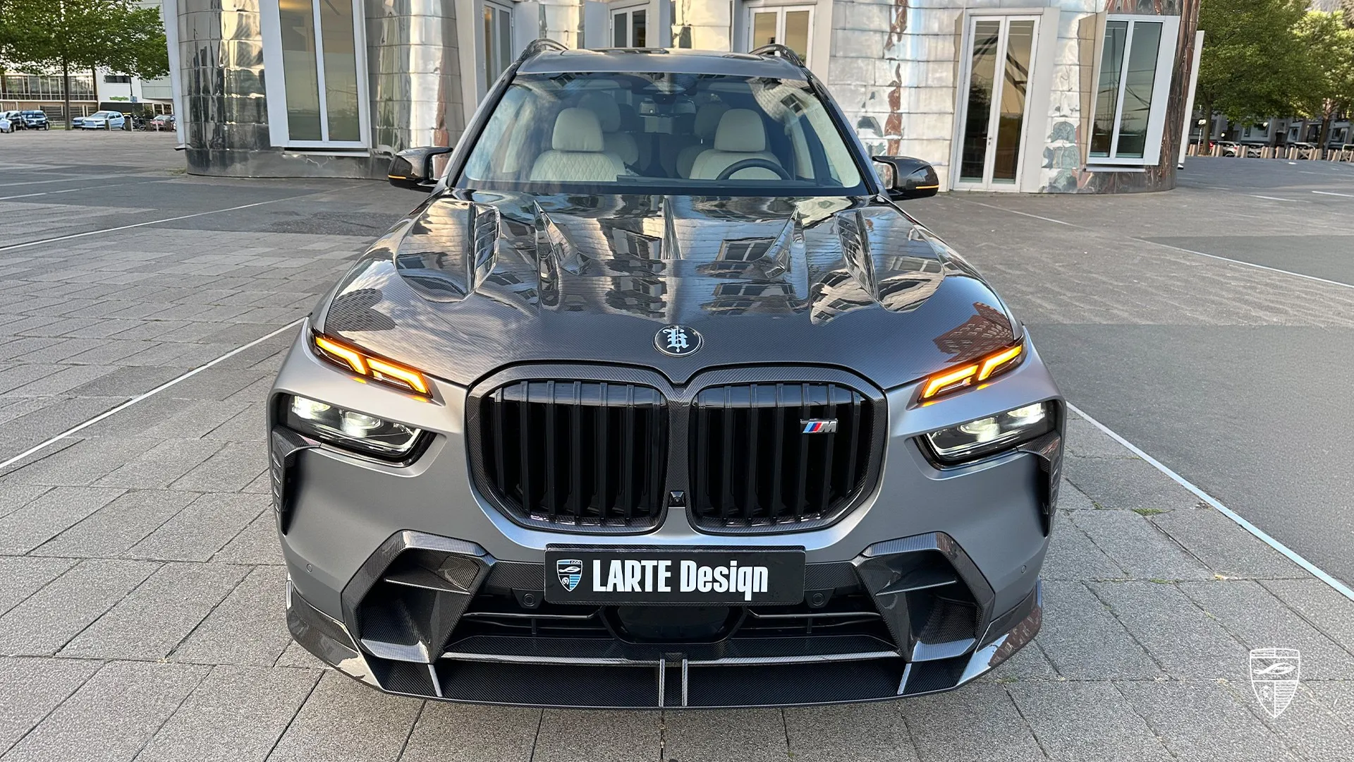 BMW X7 M60i G07 facelift front view with split LED headlights and custom styling in metallic grey luxury SUV design