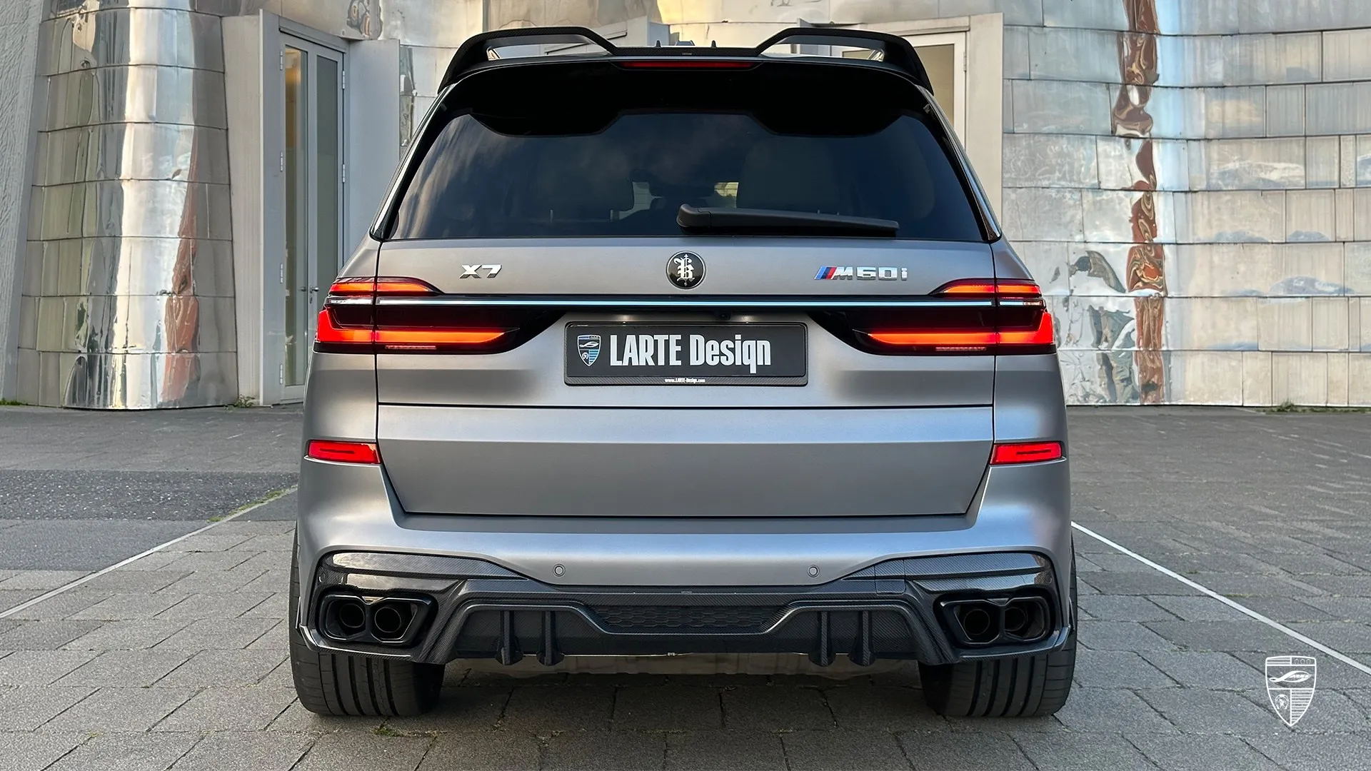 BMW X7 M60i G07 rear view with slim LED taillights and custom exhaust styling in premium tuning package