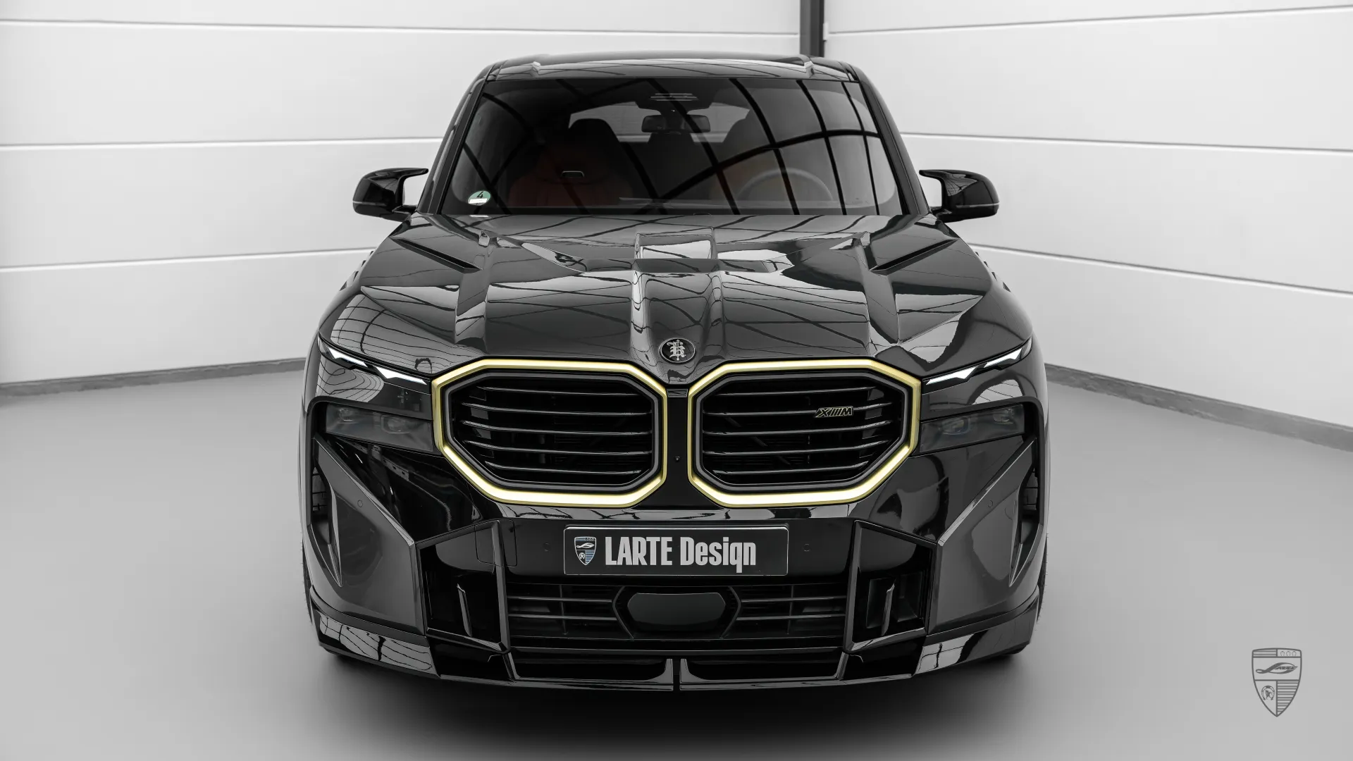 BMW XM black front view featuring modern upgrade package and aggressive exterior design