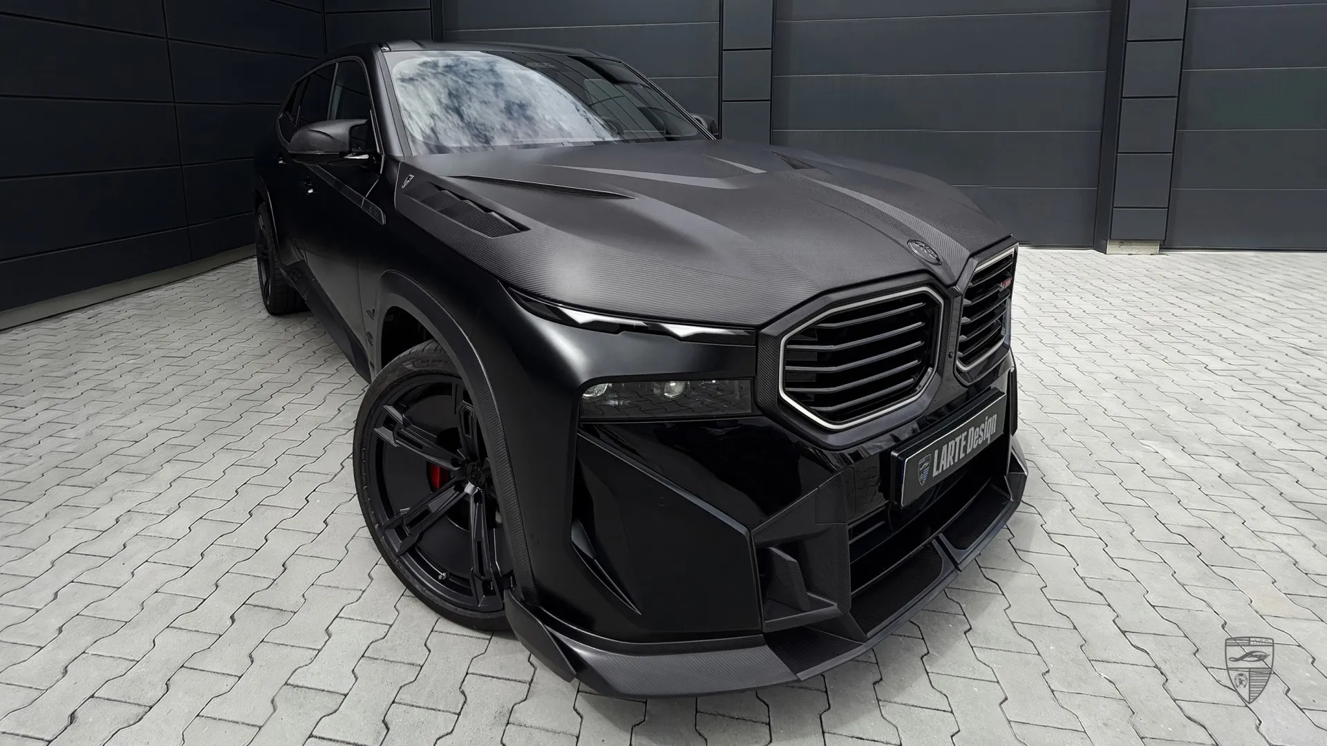 BMW XM total black in front three-quarter view with distinctive custom exterior styling