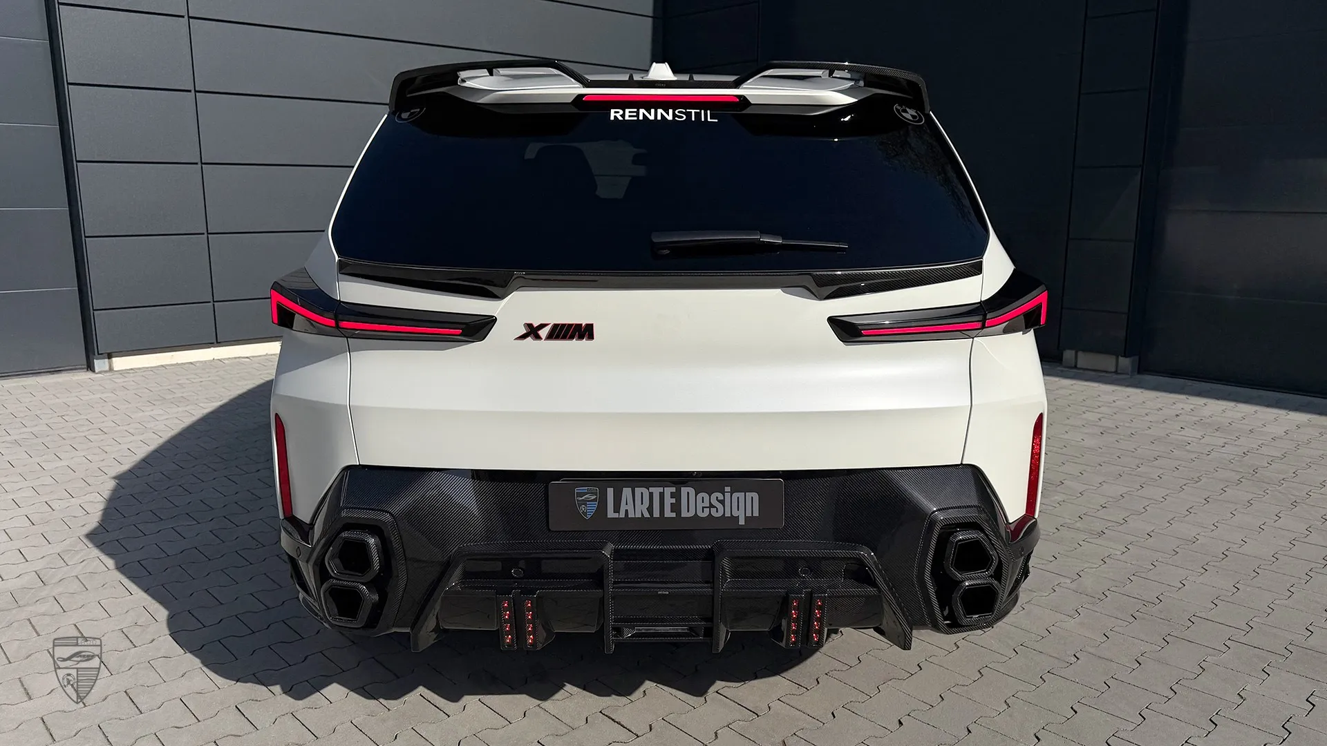 white BMW XM rear view with custom exterior upgrades and distinctive styling