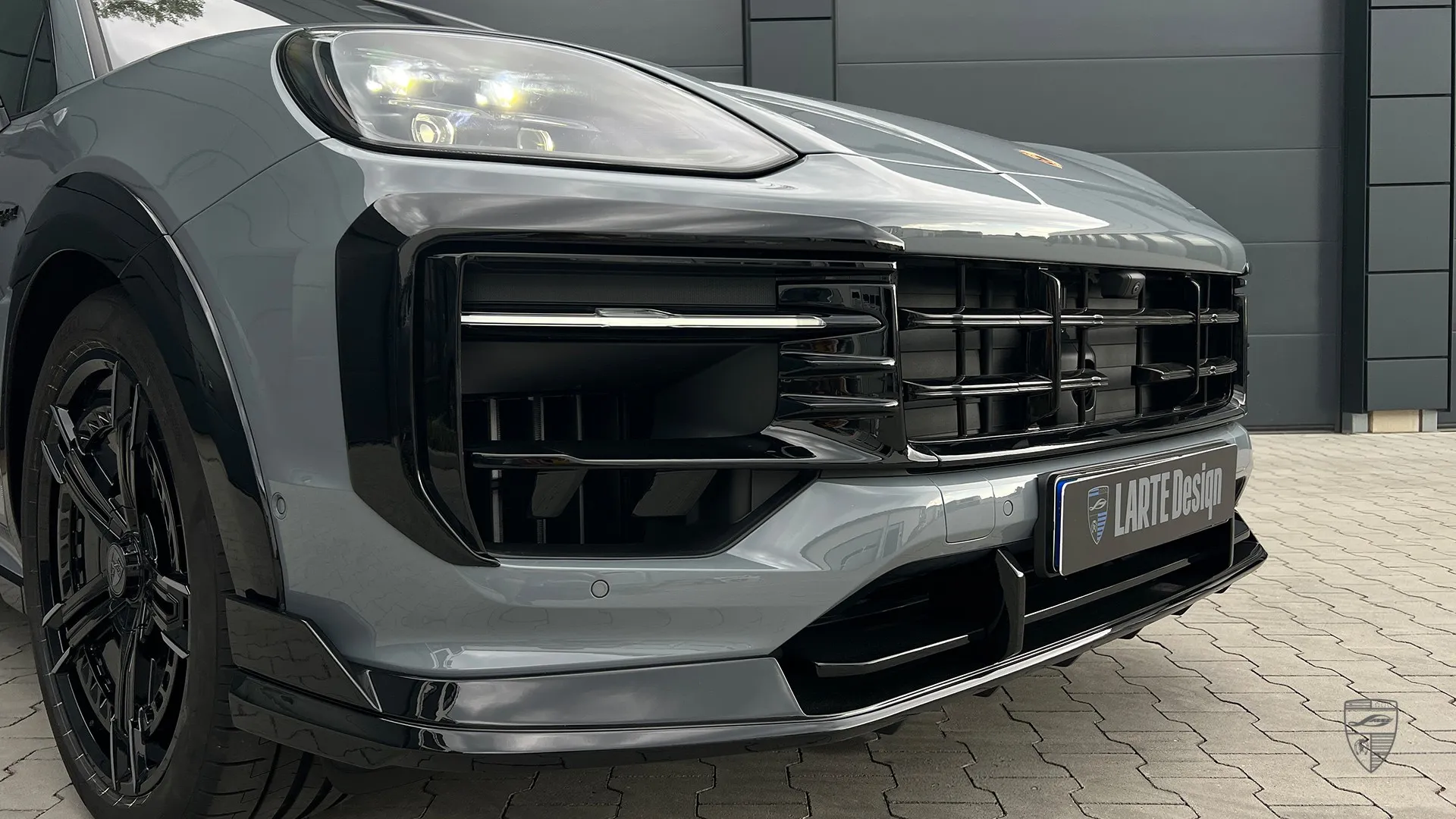 2026 Porsche Cayenne with front bumper and headlight detail in a custom exterior design