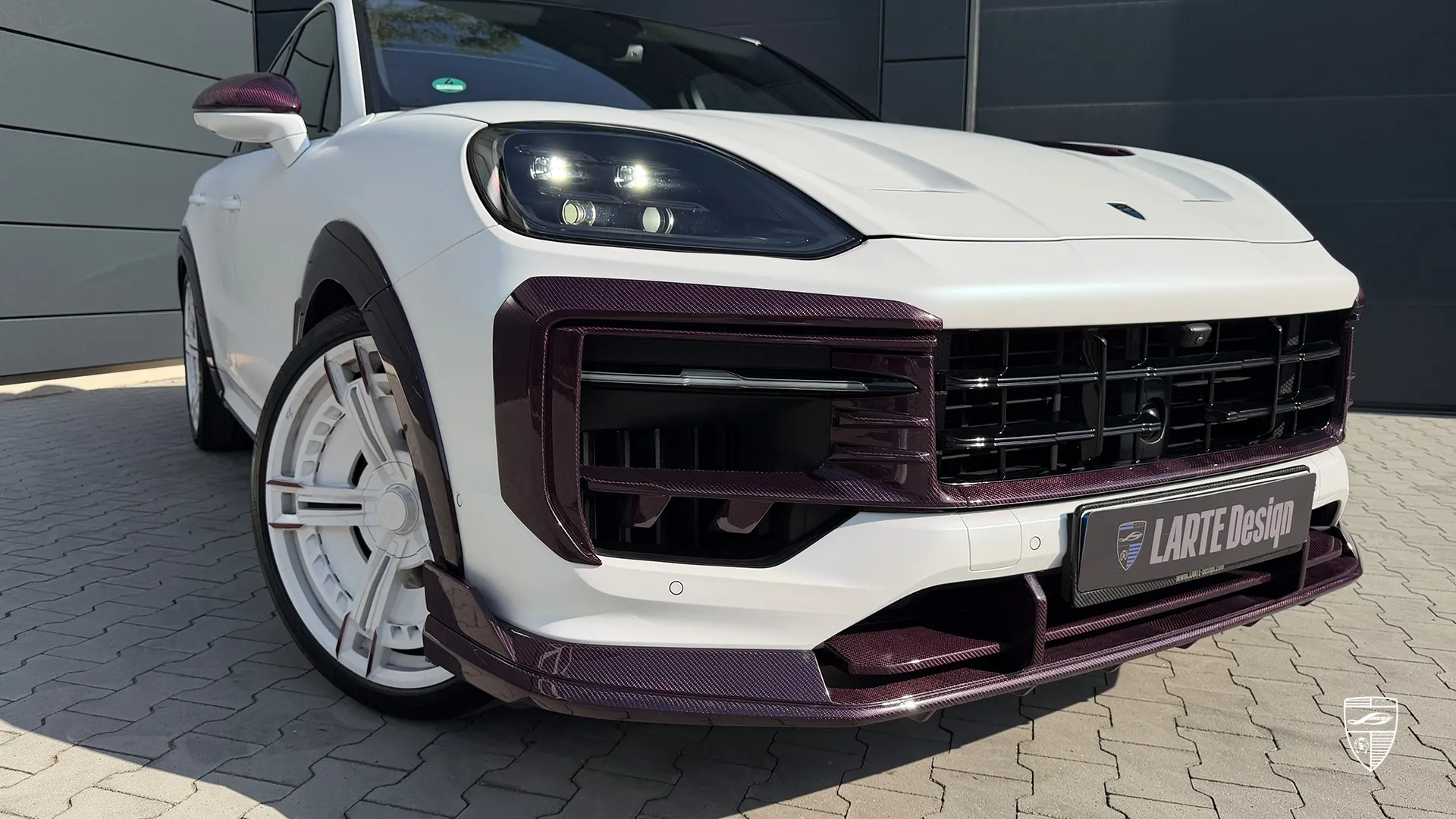 Porsche Cayenne exterior tuning featuring front bumper detail and custom styling elements