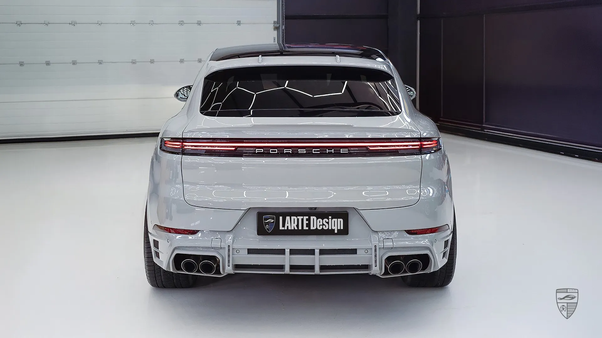 Porsche Cayenne Turbo SUV rear view in grey with performance exhaust and diffuser