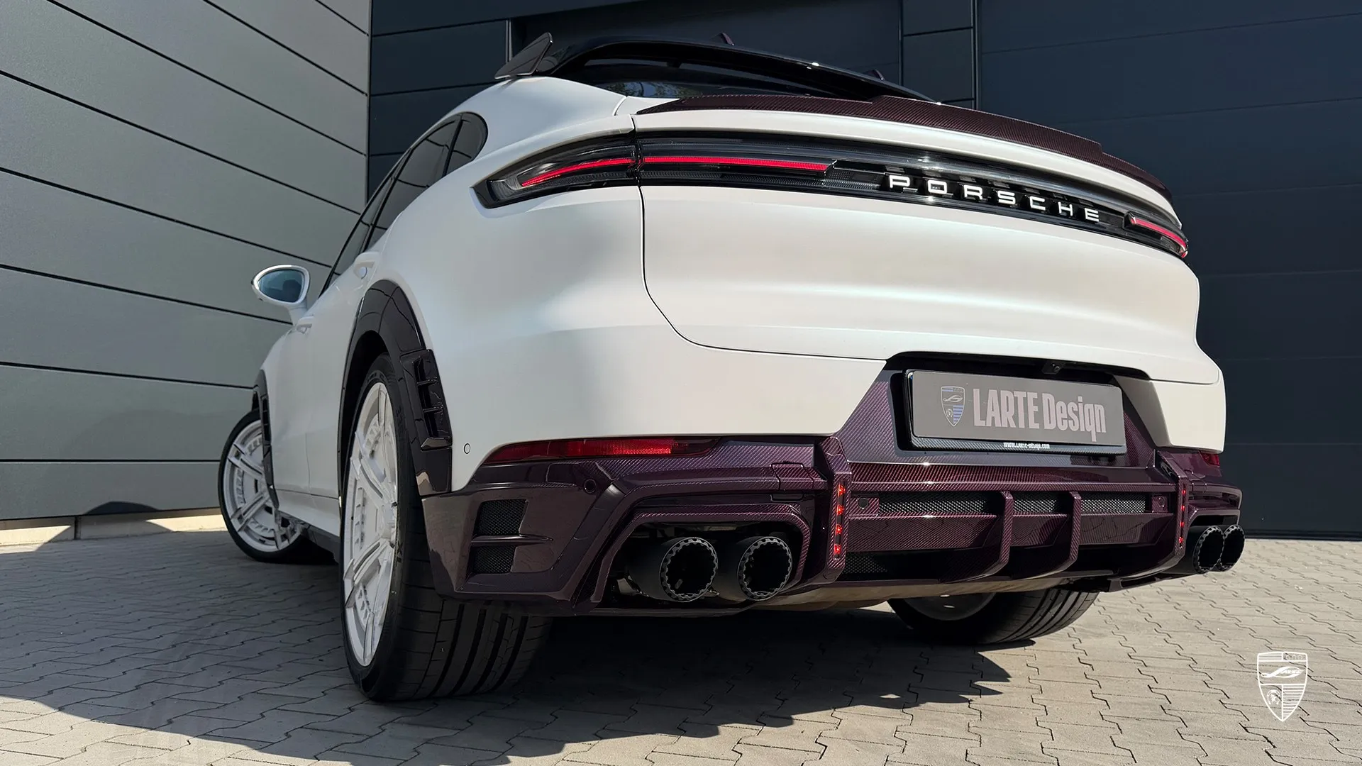 Porsche Cayenne white with custom rear styling and premium body kit enhancements