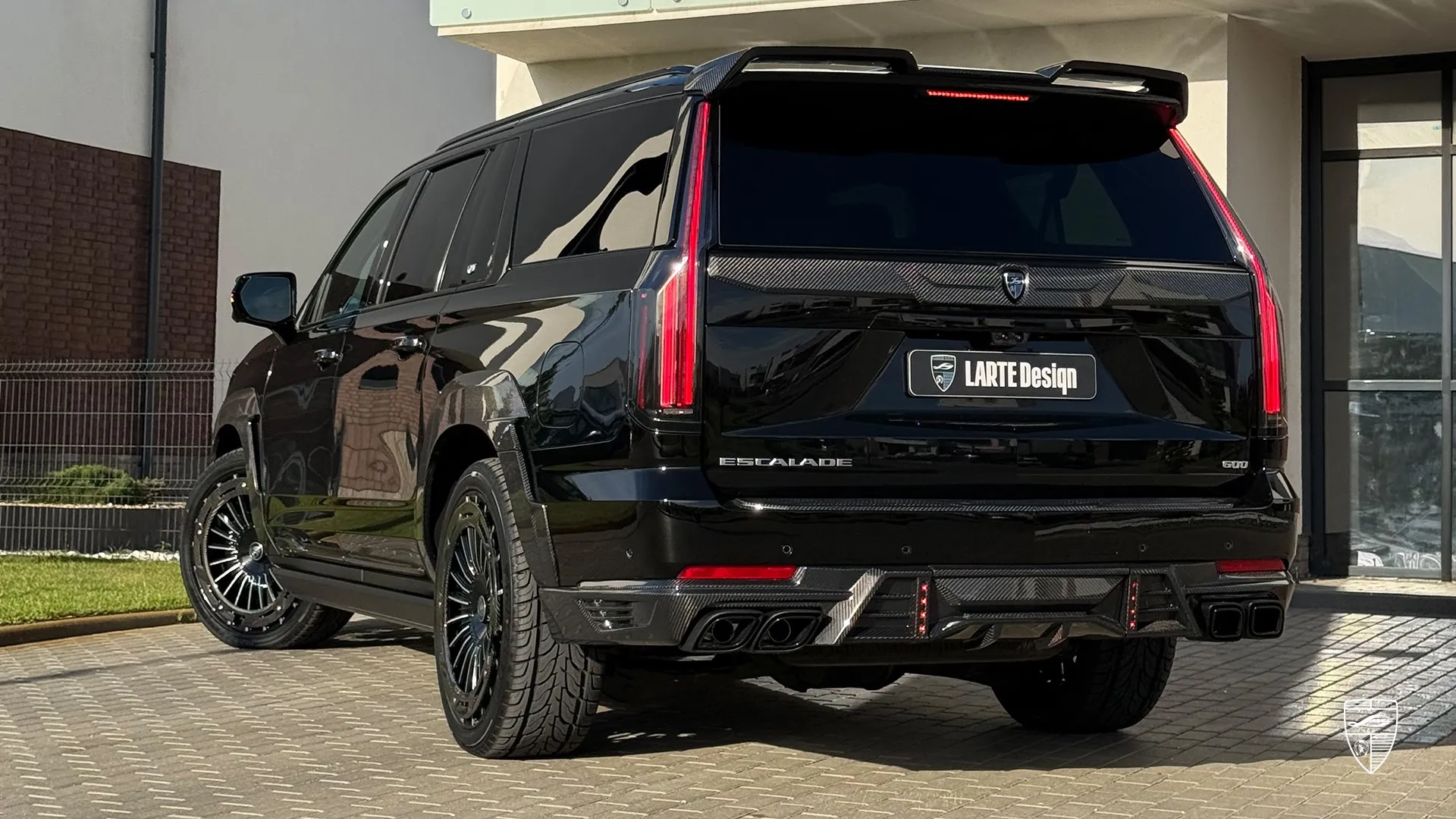 black Cadillac Escalade wallpaper with custom rear styling and luxury SUV exterior design
