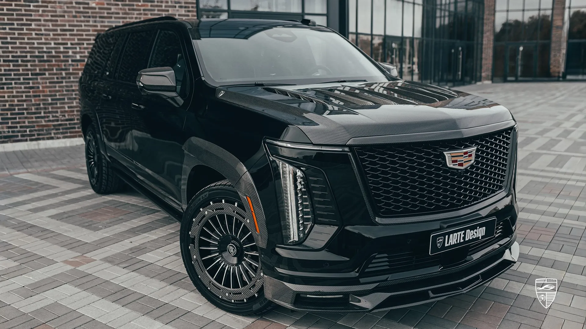 Cadillac Escalade 600 in Raven Black — custom upgrade with carbon package and aggressive styling