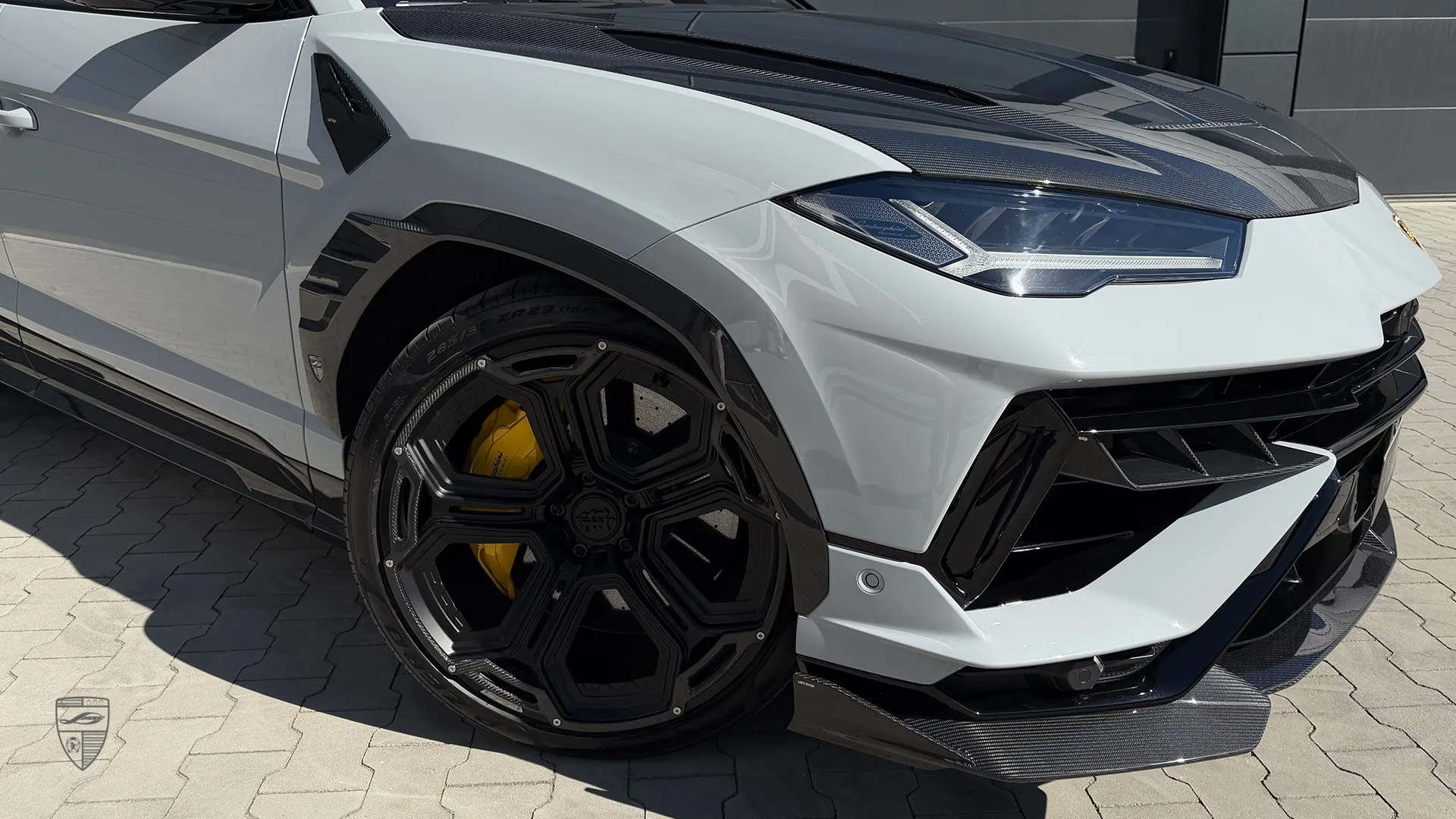 Lamborghini Urus Performante white with carbon wheel detail and aggressive exterior styling
