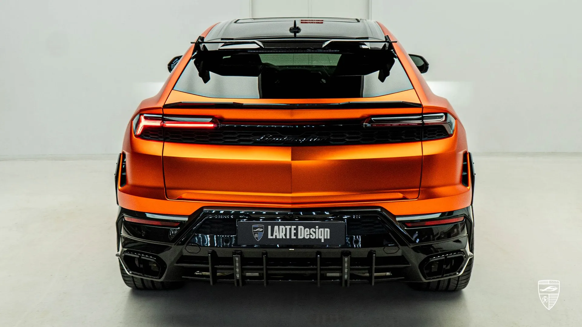 orange Lamborghini URUS SE in rear view with unique styling and custom exterior upgrades