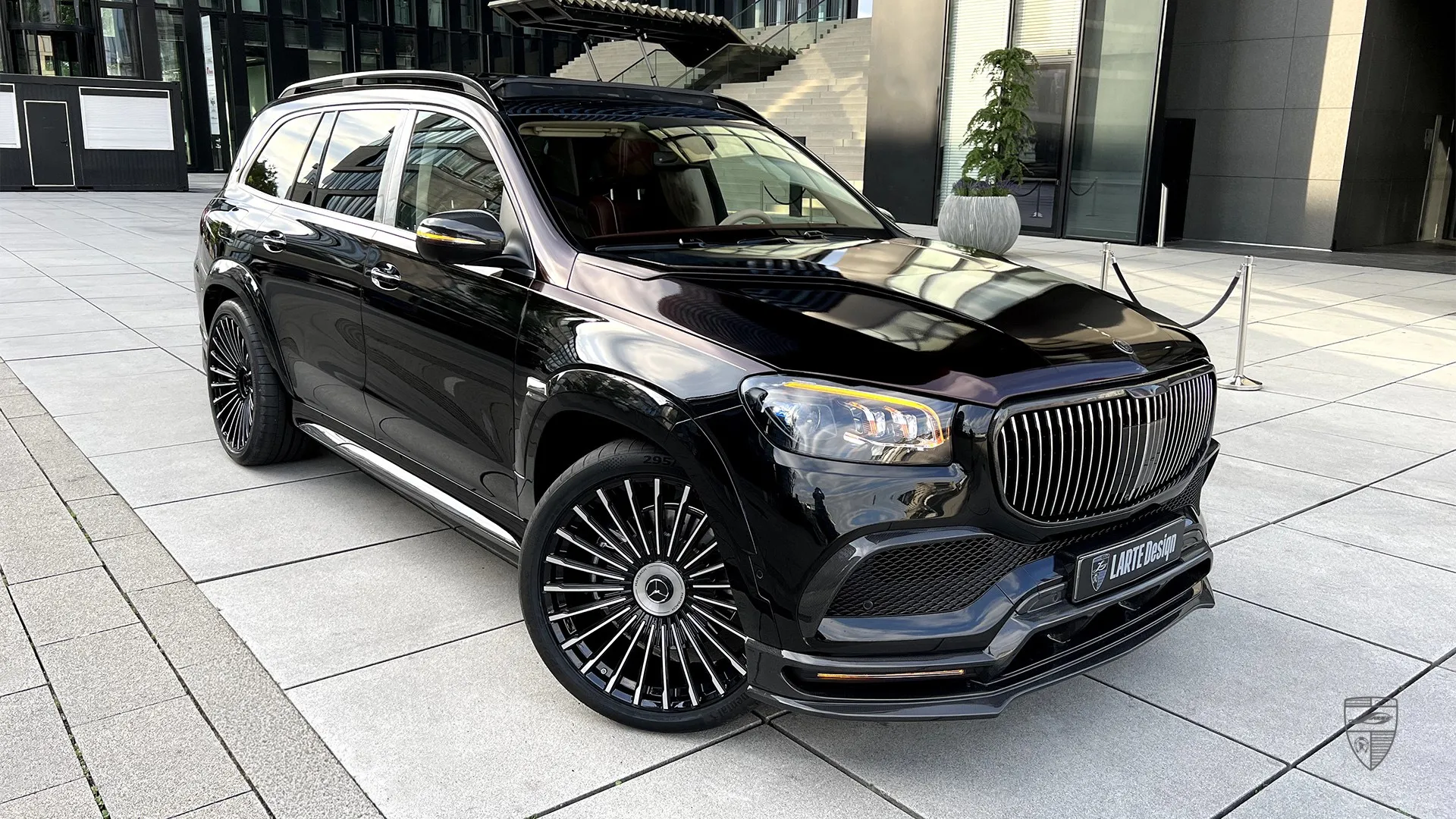 Black Maybach GLS 600 front view with modified exterior, carbon wheels and premium body kit