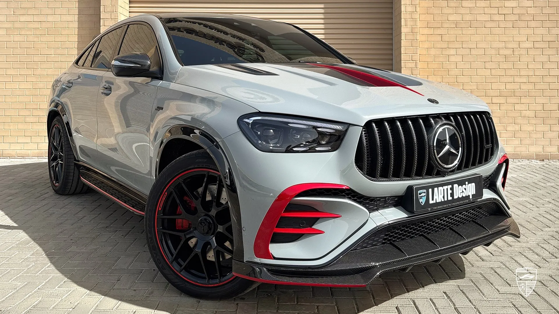 Mercedes AMG GLE 53 Coupe Facelift front three quarter view with red aerodynamic accents