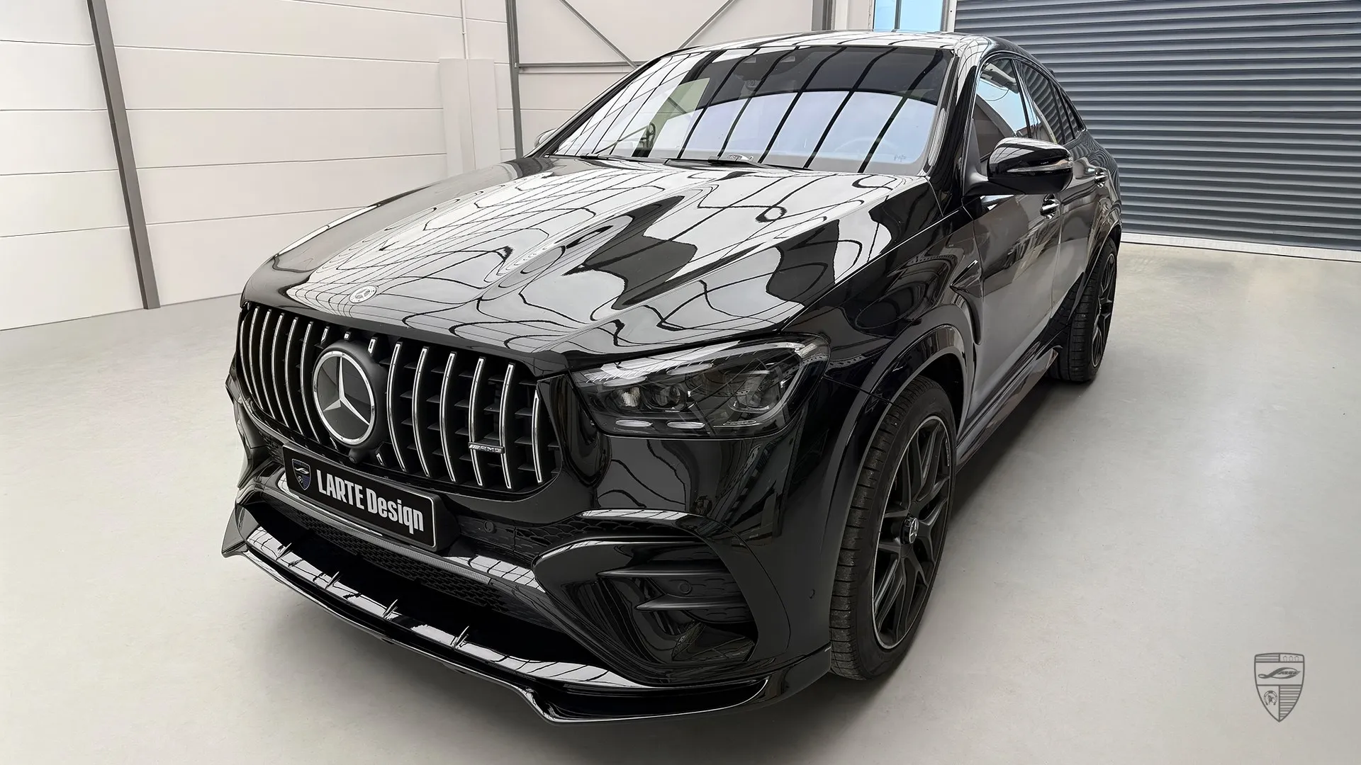New Mercedes GLE Coupe facelift black SUV parked indoors