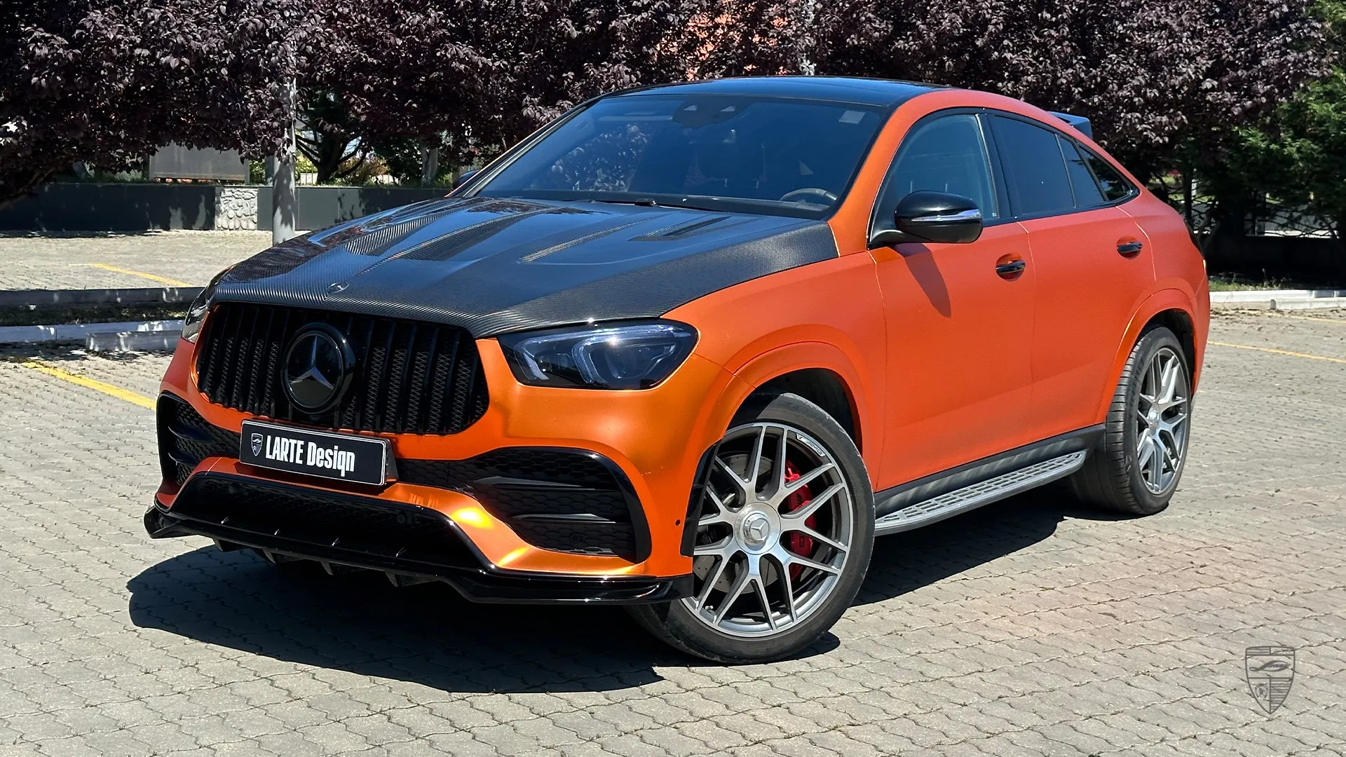 GLE Coupe 53 AMG orange with carbon custom exterior front three quarter view