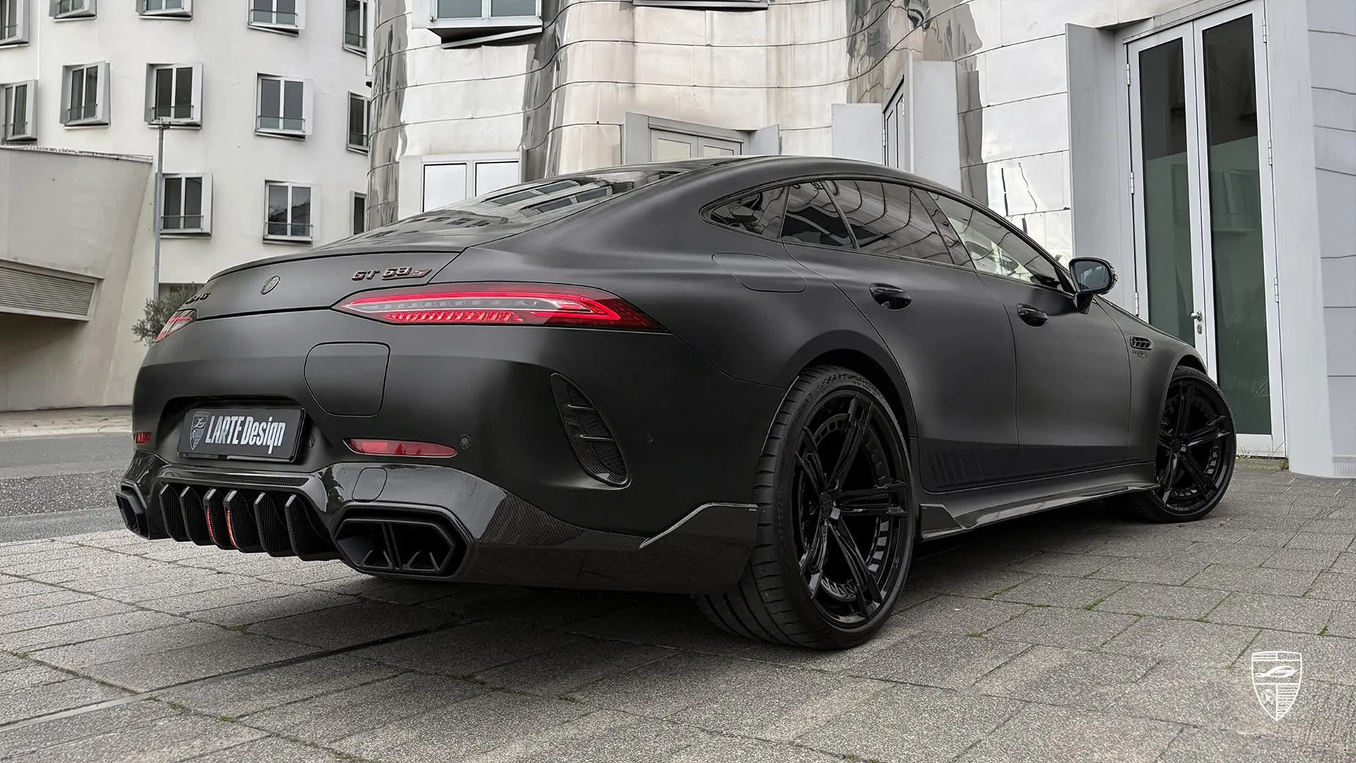 Mercedes-AMG GT 63 rear three quarter view in black matte with exterior upgrades