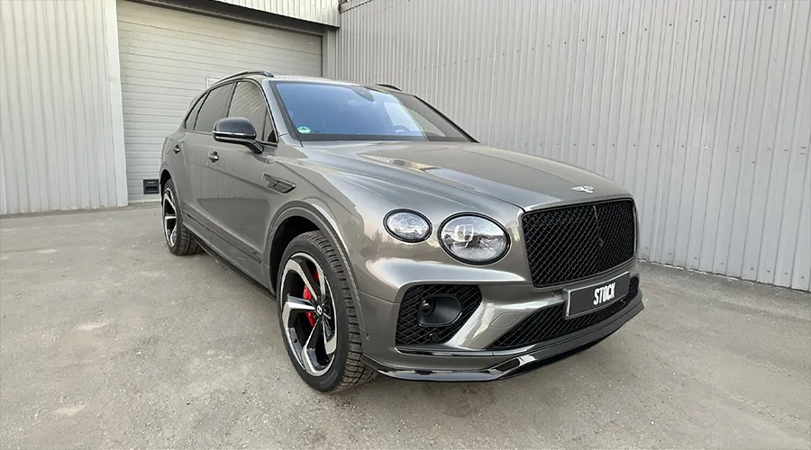 Front angle view on a BENTLEY BENTAYGA MLB-2020-2024 with a body kit giving the car a custom appearance
