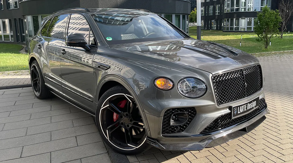 Front angle view on a BENTLEY BENTAYGA MLB-2020-2024 with a body kit giving the car a custom appearance