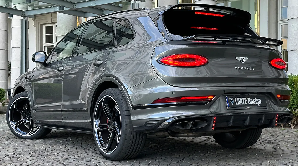 Rear angle view on a BENTLEY BENTAYGA MLB-2020-2024 with a body kit giving the car a custom appearance