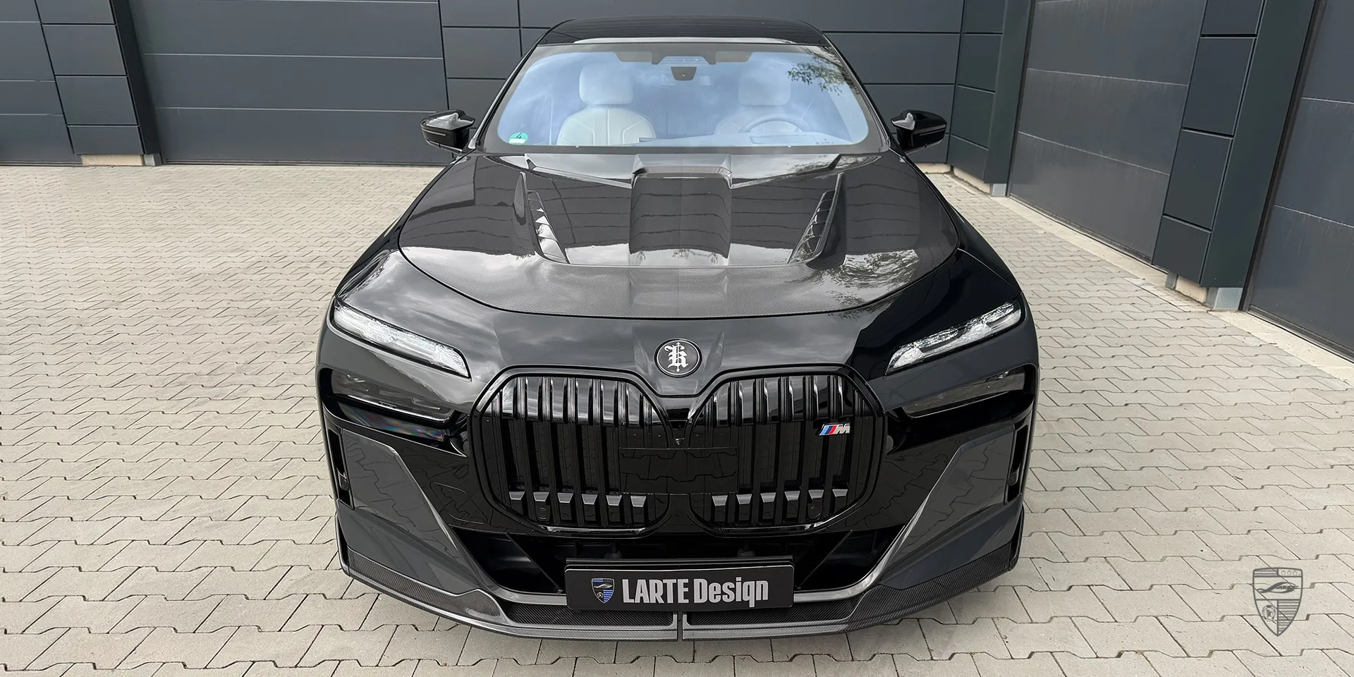 Aggressive body kit for BMW 7 Series showcases pronounced lines for an assertive stance
