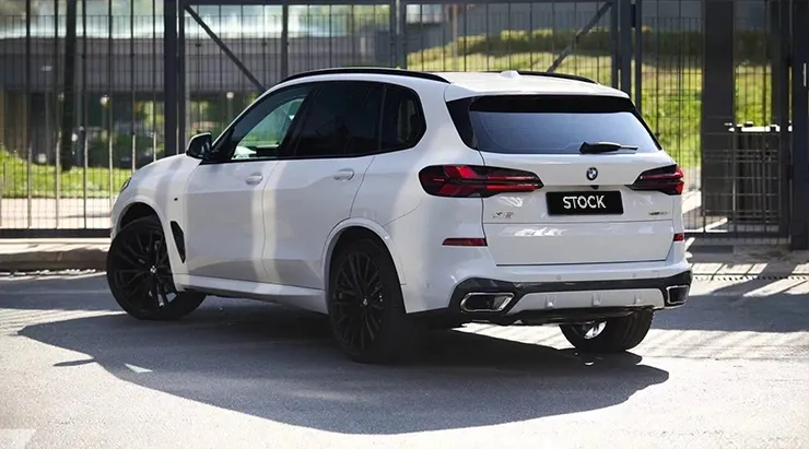 Rear angle view on a BMW X5 G05 LCI Facelift 2023 with a body kit giving the car a custom appearance