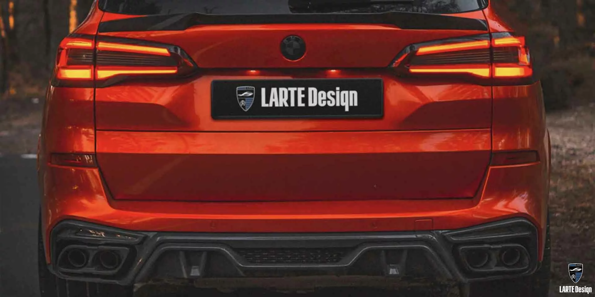 Addon aerodynamic diffusers for BMW X5 M sport G05 in a wrap red from LARTE Design