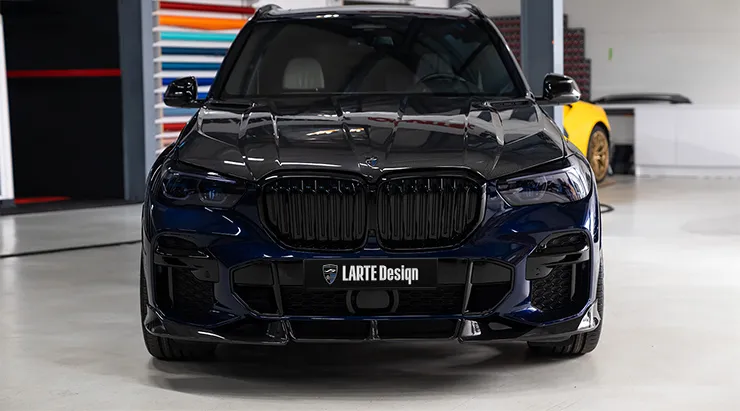 Front view on a BMW X5 G05 with a body kit giving the car a custom appearance