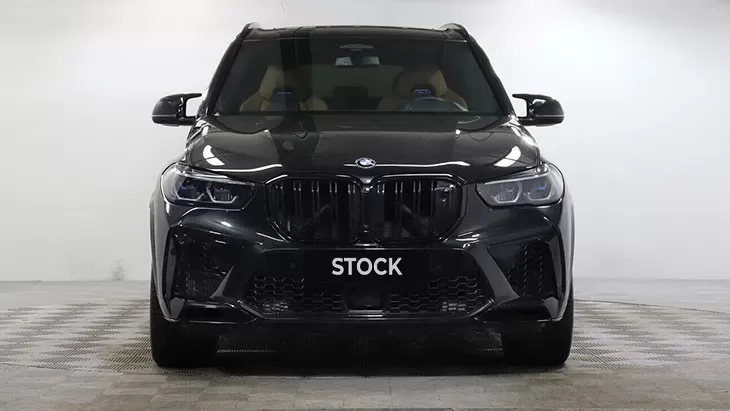 Front view on a BMW X5M Competition F95 with a body kit giving the car a custom appearance