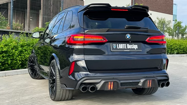 Rear angle view on a BMW X5M Competition F95 with a body kit giving the car a custom appearance