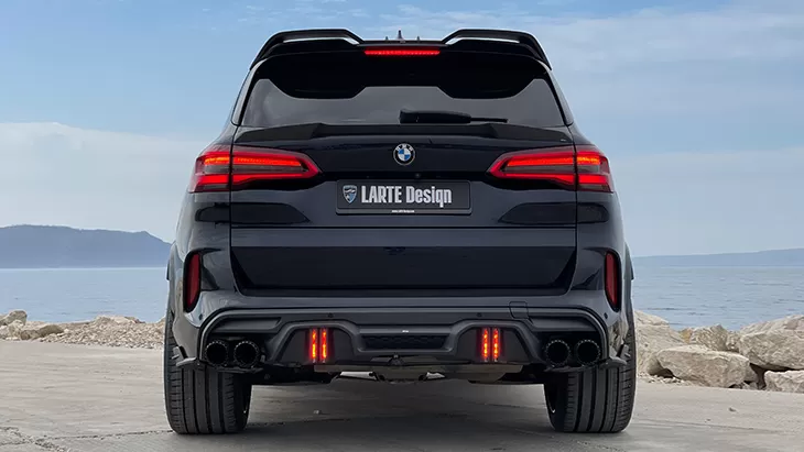 Rear view on a BMW X5M Competition F95 with a body kit giving the car a custom appearance