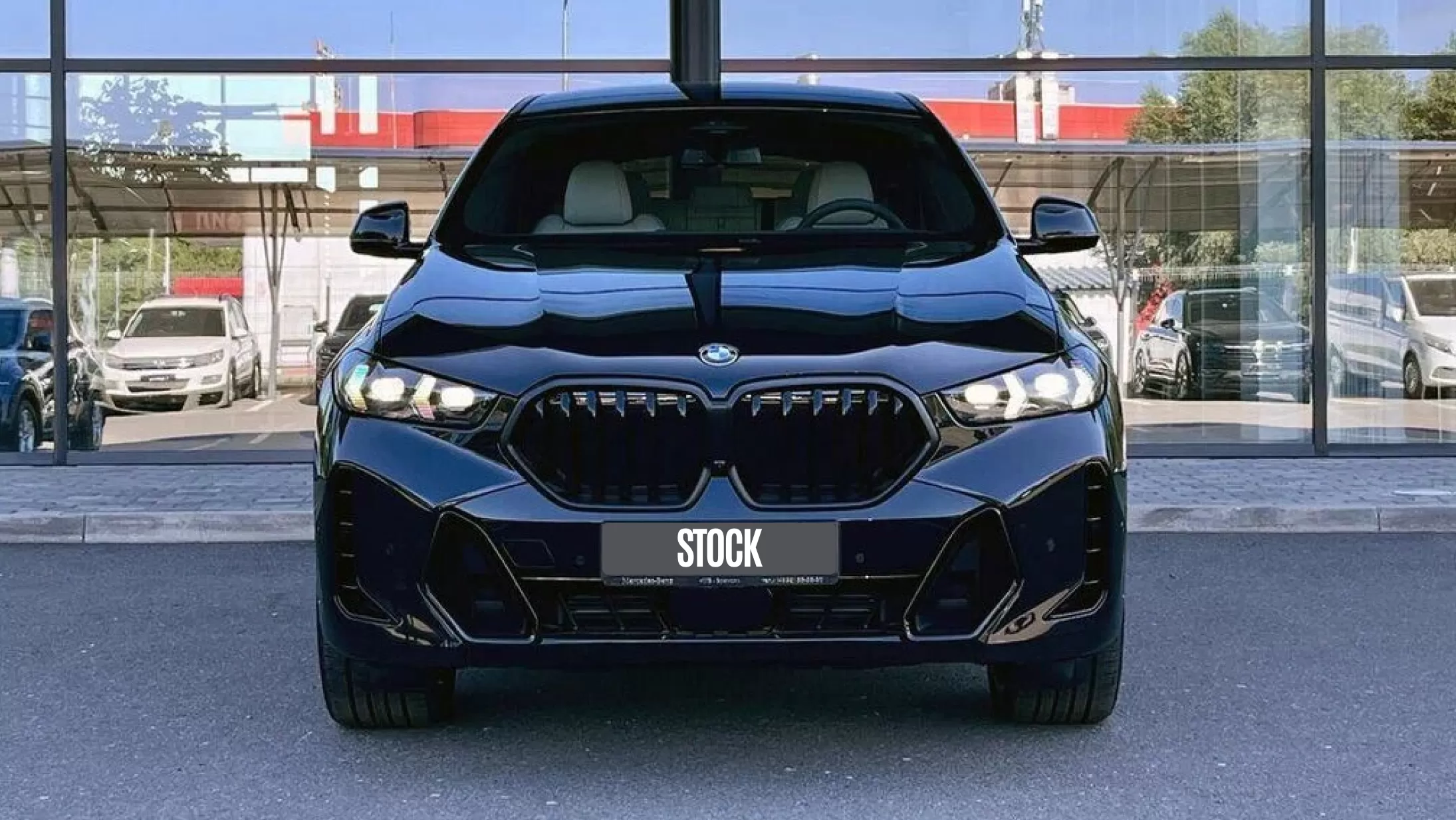 Front view on a BMW X6 LCI Facelift with a body kit giving the car a custom appearance