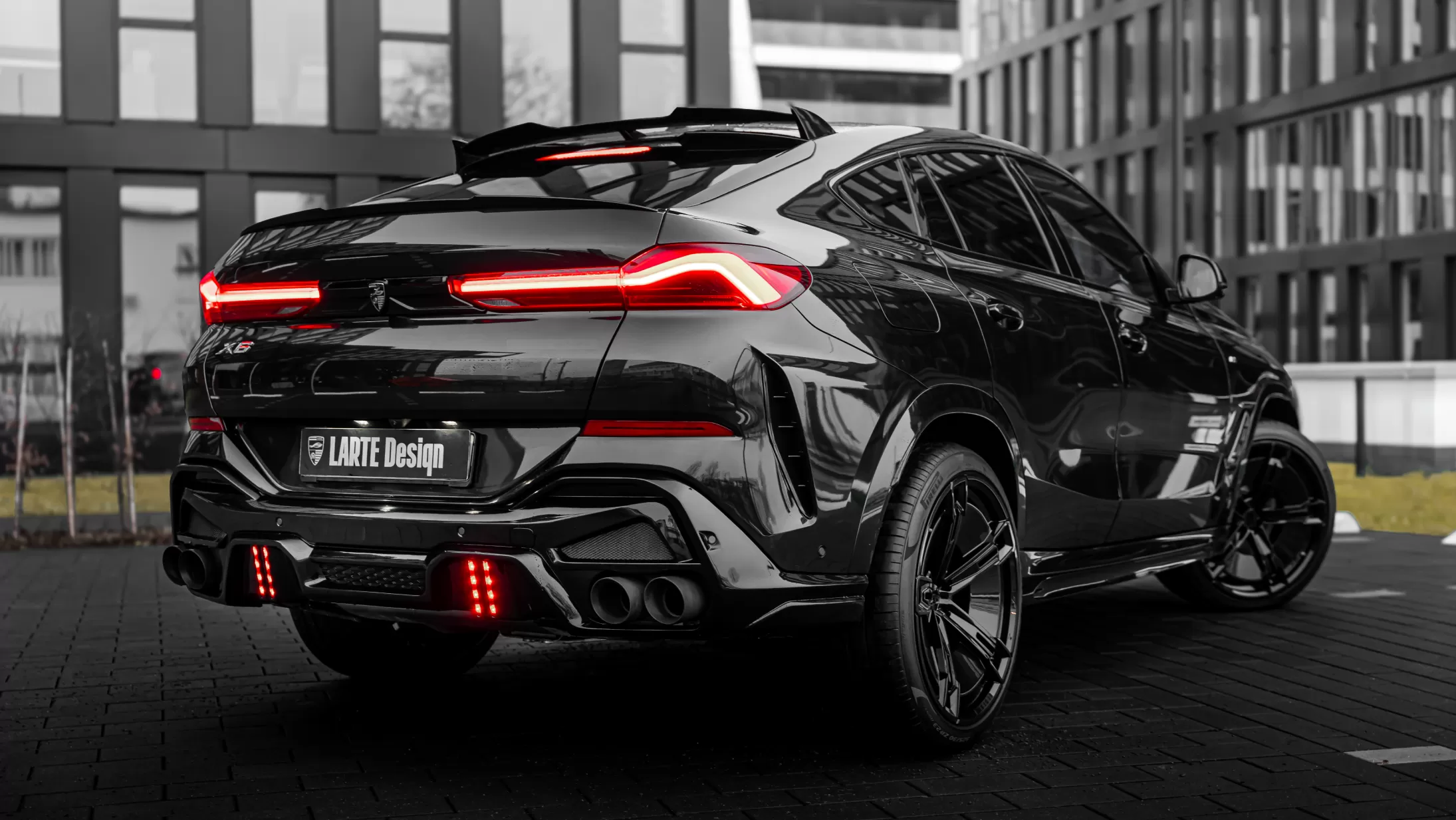 Rear angle view on a BMW X6 LCI Facelift with a body kit giving the car a custom appearance