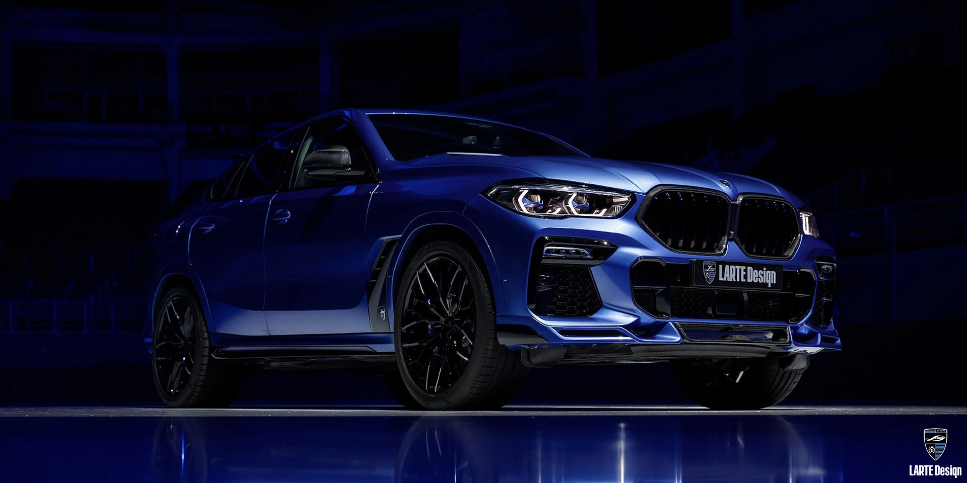 BMW X6 in Phytonic Blue Metallic color with carbon fiber body kit