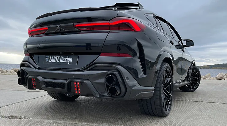 Rear angle view on a BMW X6 with a body kit giving the car a custom appearance