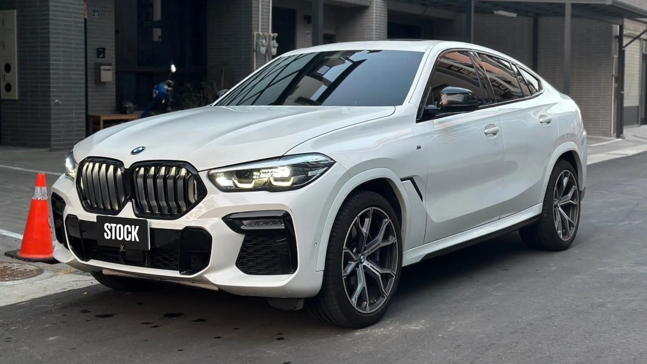 Front angle view on a BMW X6 with a body kit giving the car a custom appearance