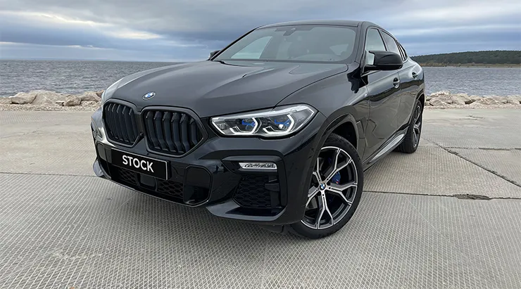 Front angle view on a BMW X6 with a body kit giving the car a custom appearance